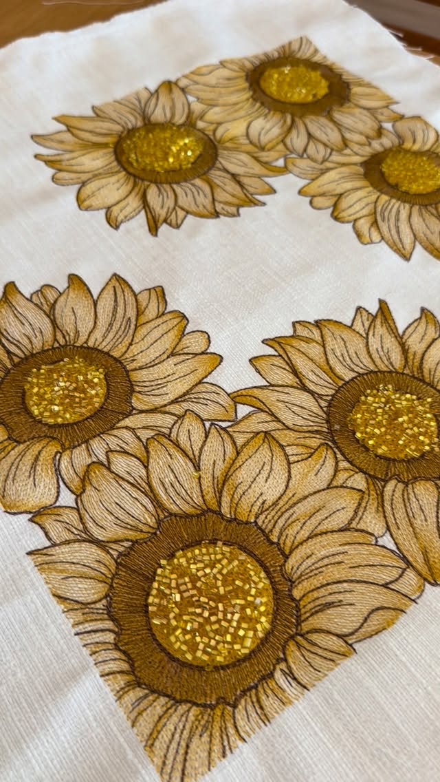 Beaded Sunflower Cushion by Baysal Home, Sunflower cushions enriched with beadwork at the flower centers.