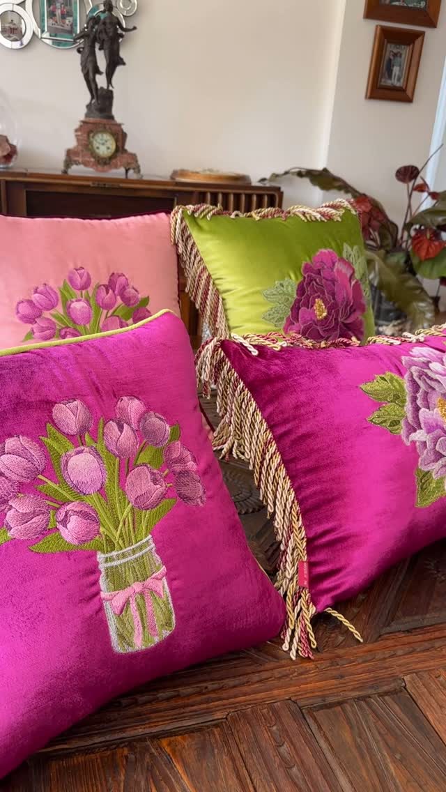 Colorful Floral Cushions by Baysal Home, A lively group of cushions with floral embroidery in fuchsia, pink, and green tones.